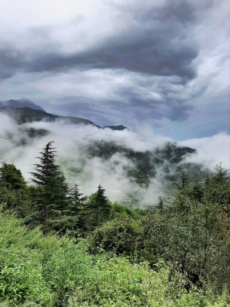 An photograph of monsoon clouds hanging low in the lower Himalayas, near Dharamshala, Himachal Pradesh