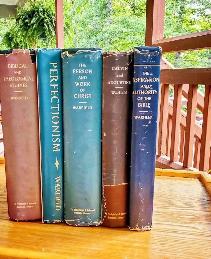Five books from the Biblical literature placed on a table