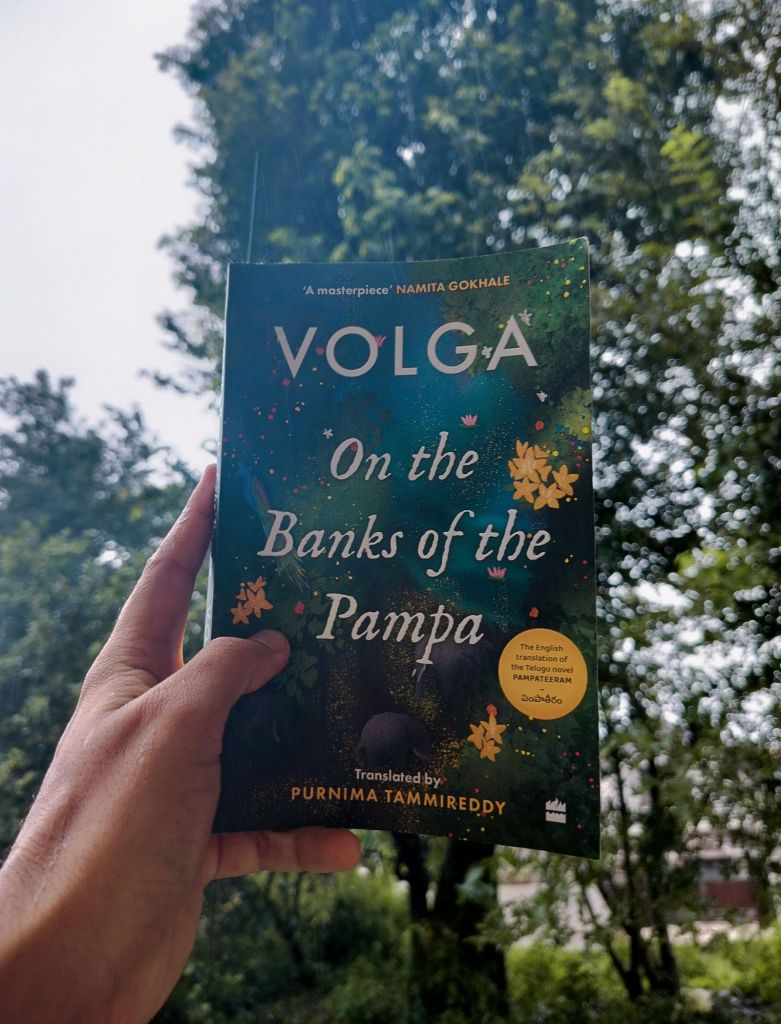 Holding Volga's book On the Banks of Pampa